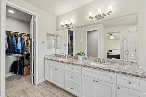 a white bath tub sitting next to a shower