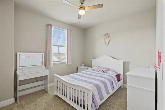 a bedroom with a bed and a couch