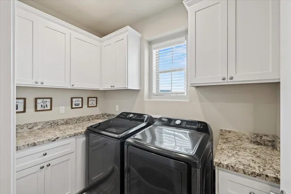 a view of a house with backyard and porch