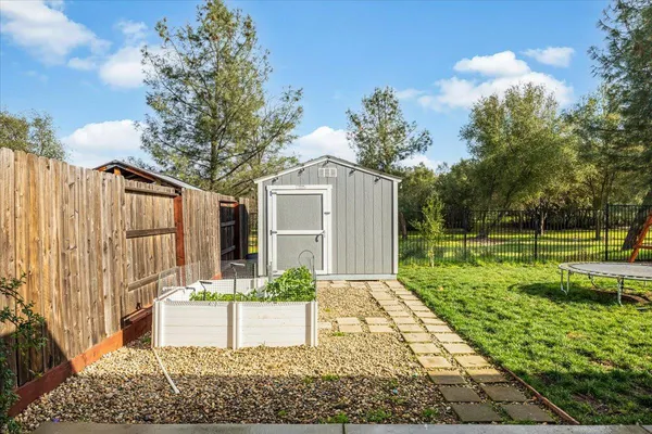 a view of a garden with a slide