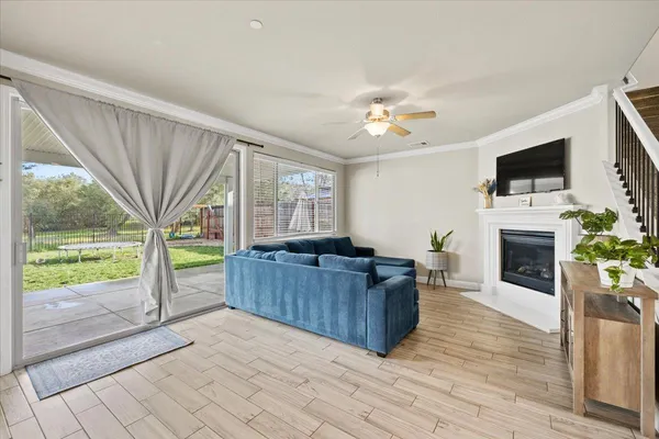 a living room with furniture fireplace and flat screen tv
