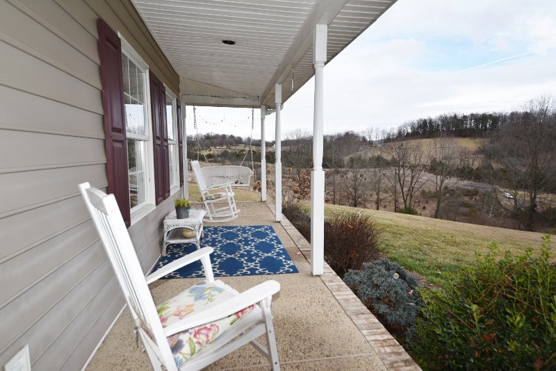 595 Hundley Distillery Road Churchville, VA 24421 - Photo 3 of 43 a balcony with table and chairs