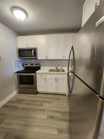 a utility room with washer and dryer