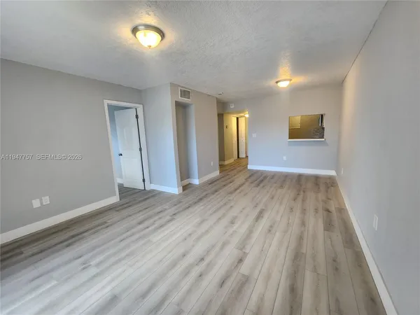 wooden floor in a hall with an entryway
