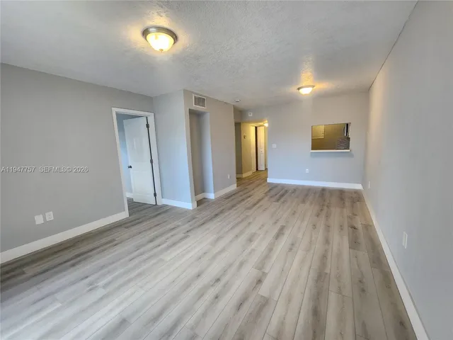 wooden floor in a hall with an entryway