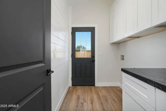 a kitchen with a sink and cabinets