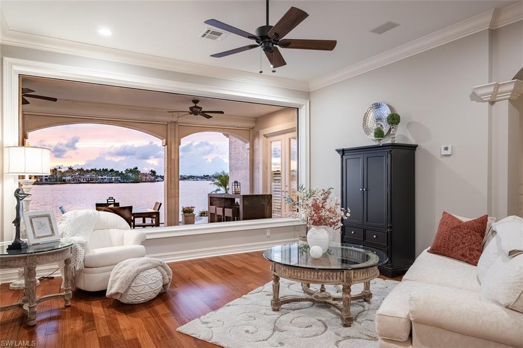 1942 Kingfish Road Naples, FL 34102 - Photo 9 of 43 a living room with furniture fireplace and a large window