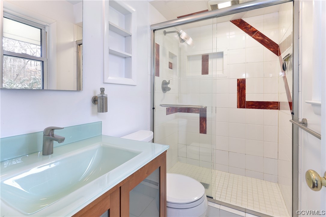 130 Cooley Road Williamsburg, VA 23188 - Photo 14 of 30 a bathroom with a granite countertop sink a toilet and shower