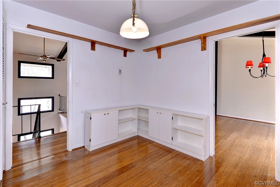 130 Cooley Road Williamsburg, VA 23188 - Photo 9 of 30 a view of a livingroom with wooden floor and a ceiling fan