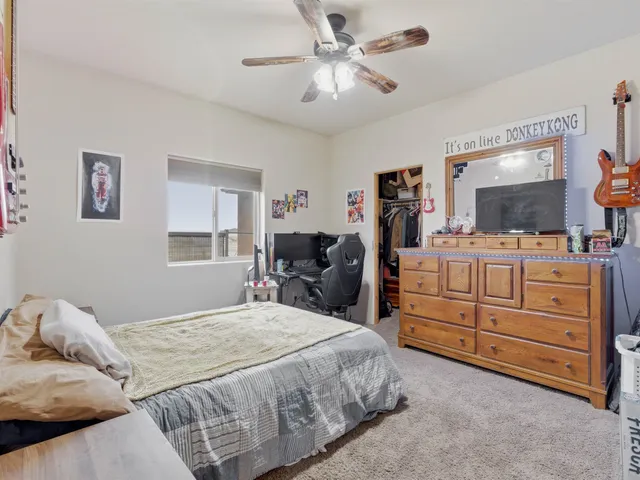 a bedroom with a bed and furniture