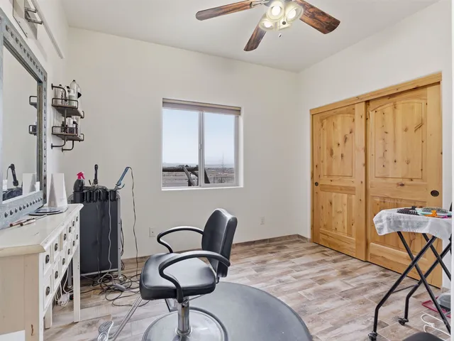 a bedroom with furniture and a window