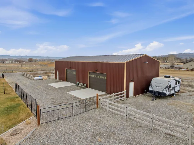 a view of a terrace with a table and chairs