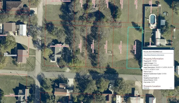 an aerial view of houses with a street