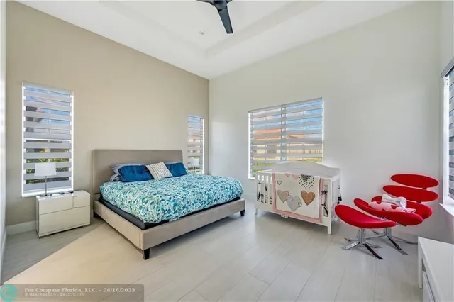 a bathroom with a glass shower door and a sink