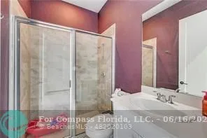a bathroom with a bathtub and shower
