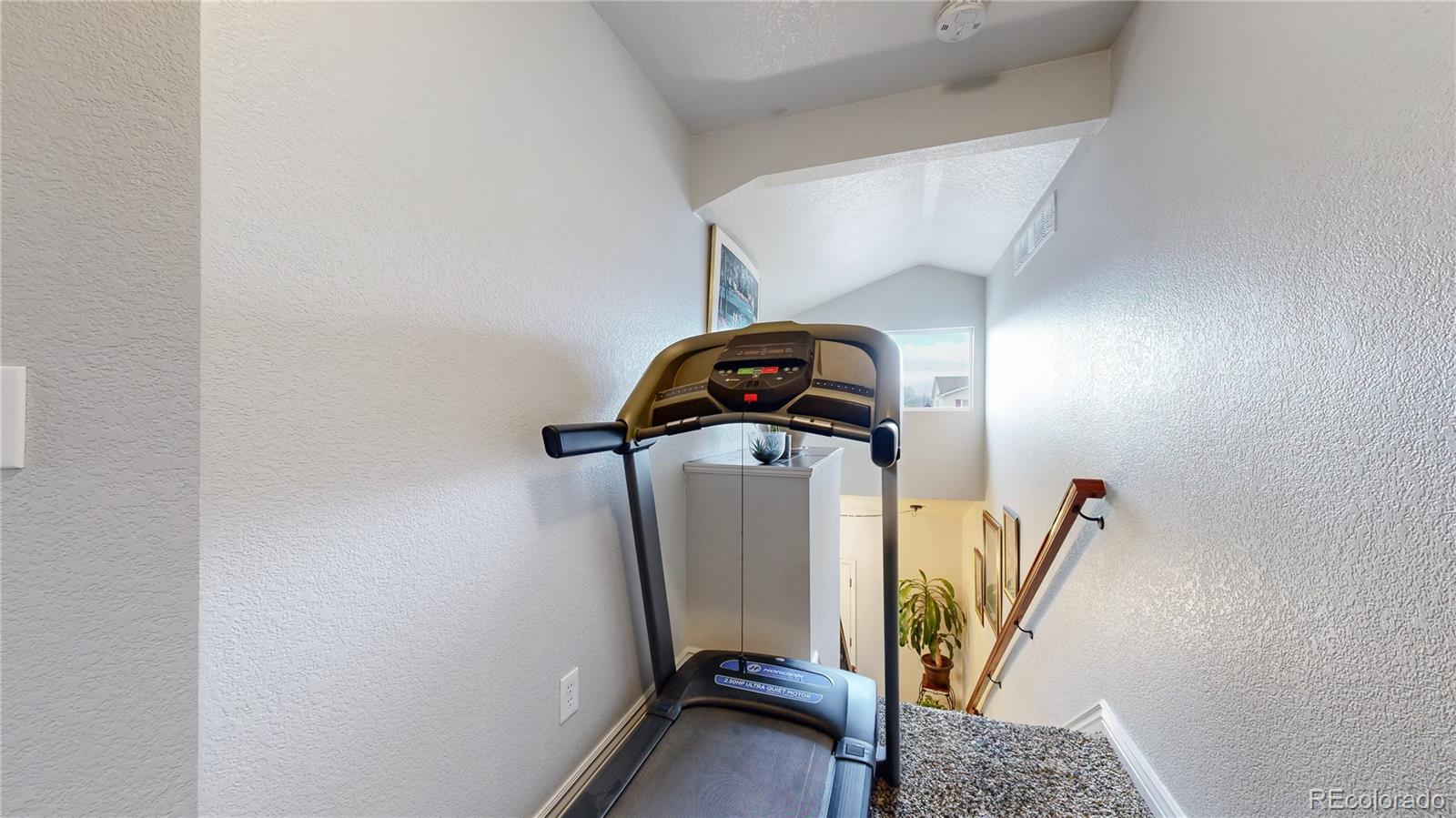 1173 Fall River Circle Longmont, CO 80504 - Photo 29 of 47 a view of a room with gym equipment