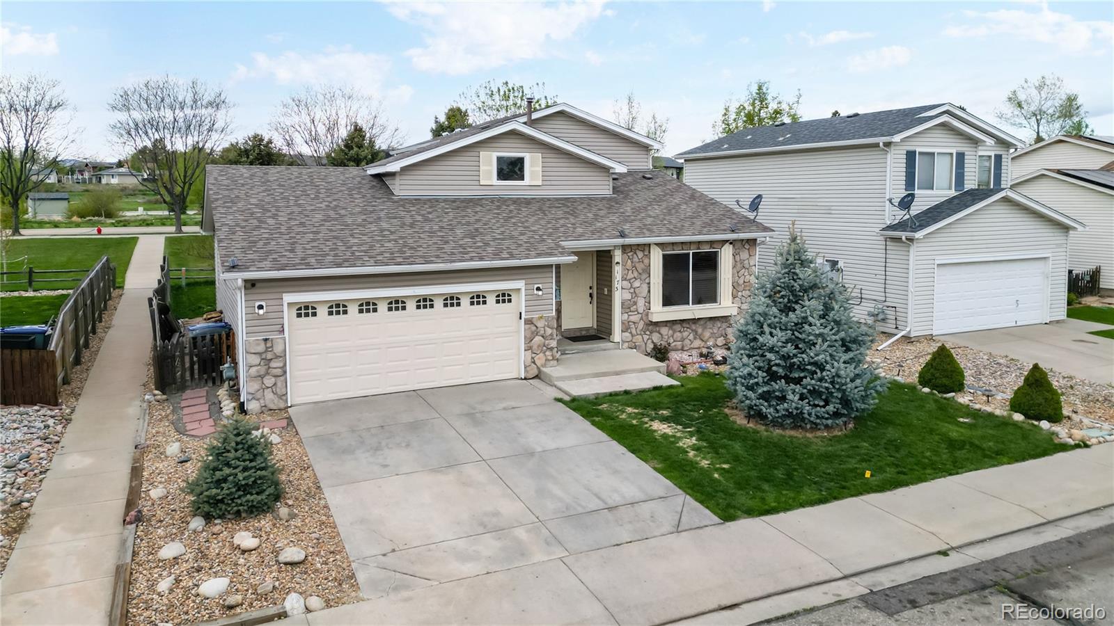 1173 Fall River Circle Longmont, CO 80504 - Photo 37 of 47 a front view of a house with garden
