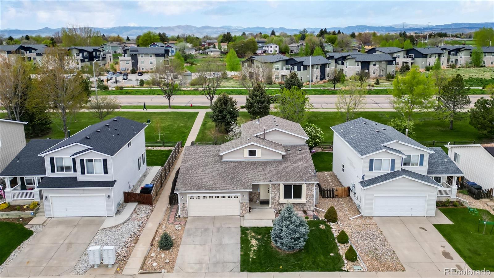 1173 Fall River Circle Longmont, CO 80504 - Photo 42 of 47 an aerial view of multiple houses with a yard