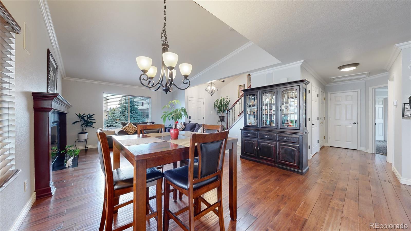 1173 Fall River Circle Longmont, CO 80504 - Photo 6 of 47 a view of a dining room with furniture window and wooden floor