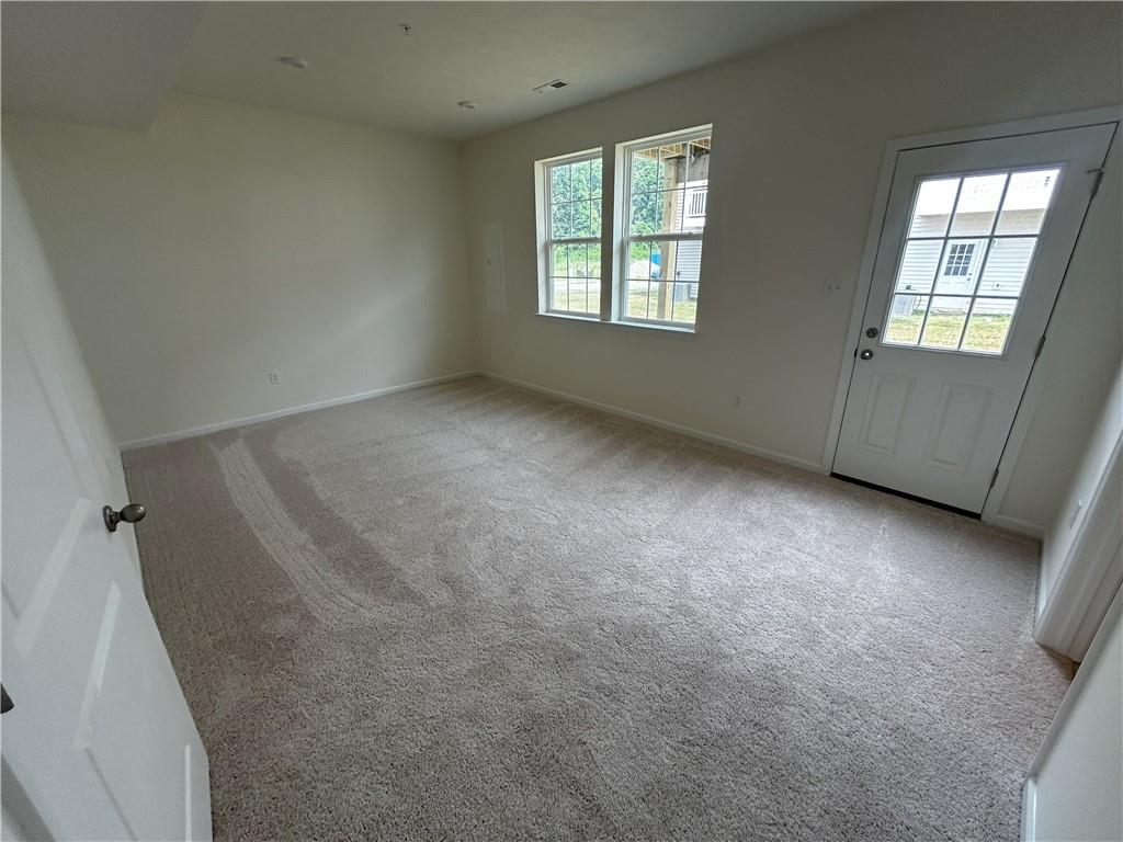 224 Truth Circle Harmony, PA 16037 - Photo 3 of 7 an empty room with windows
