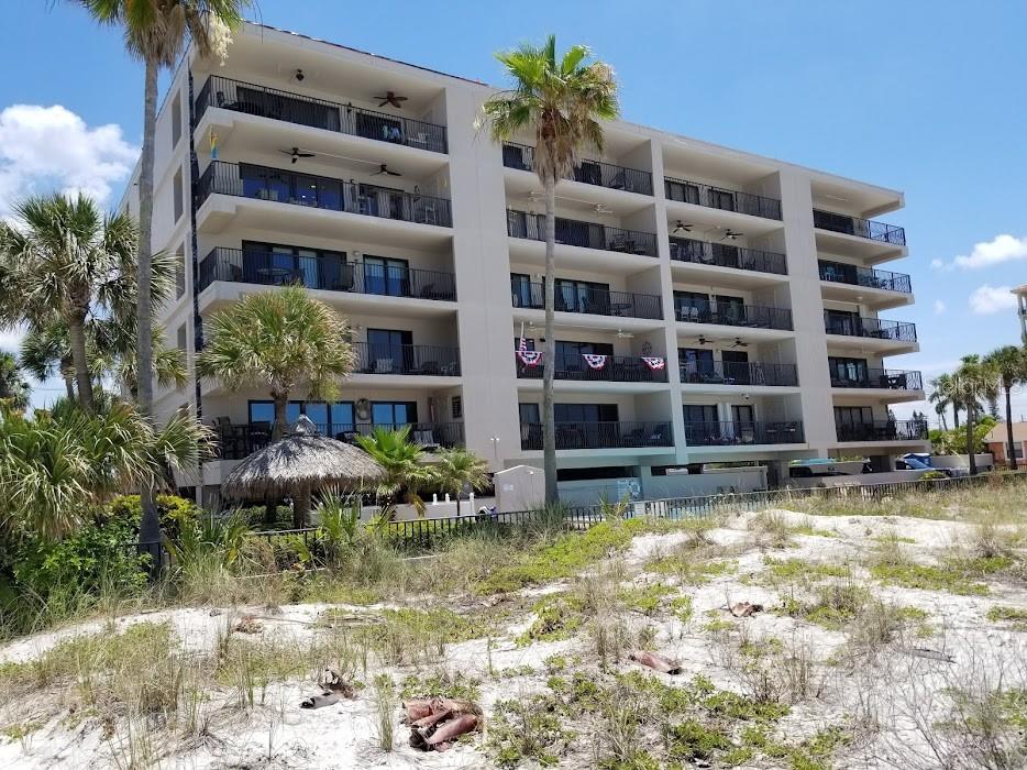 13650 Gulf Boulevard, Unit 304 Madeira Beach, FL 33708 - Photo 2 of 63 a view of building with outdoor space