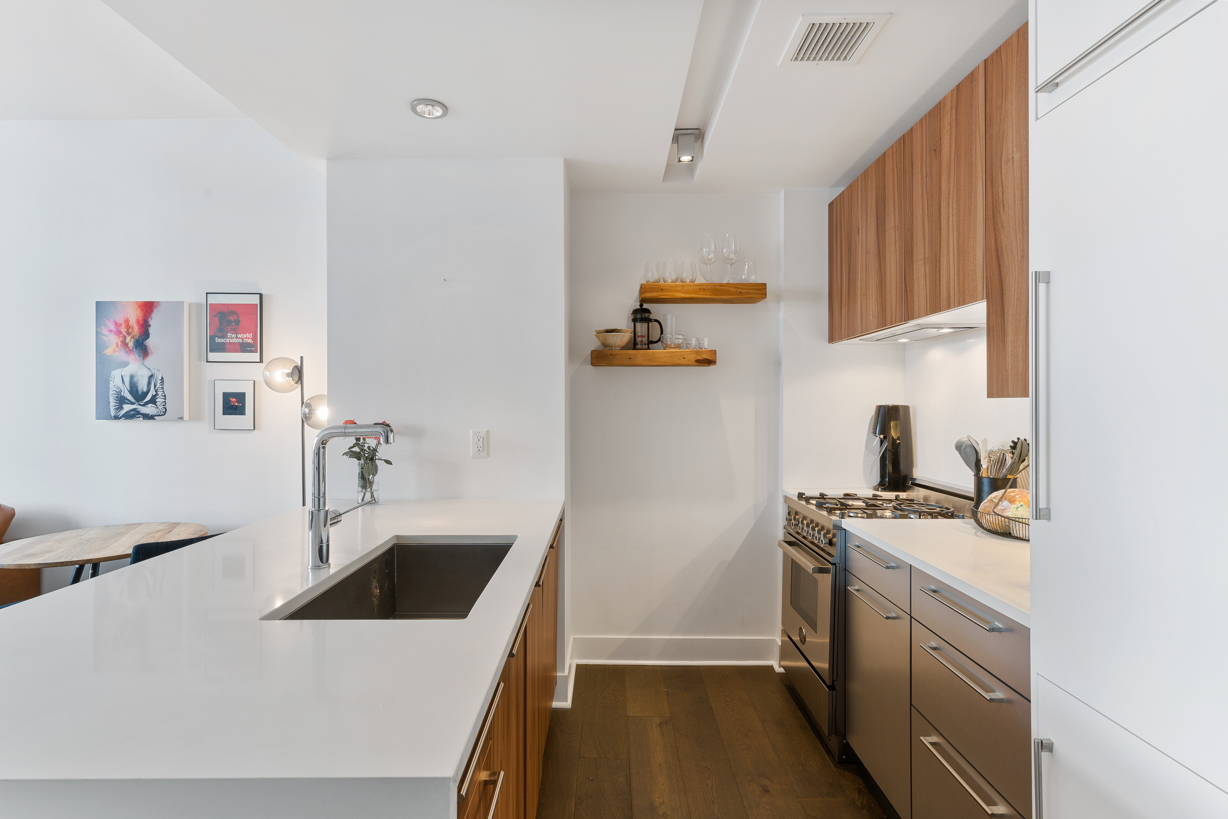 212 North 9th Street, Unit 3A Brooklyn, NY 11211 - Photo 2 of 8 a kitchen with a sink a stove and cabinets