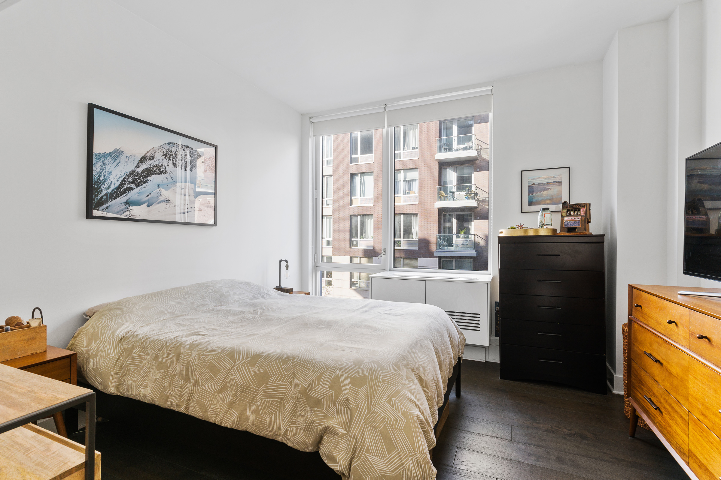 212 North 9th Street, Unit 3A Brooklyn, NY 11211 - Photo 5 of 8 a bedroom with a bed and wooden floor