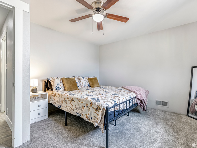 523 South Main Street Payson, UT 84651 - Photo 20 of 41 Carpeted room featuring a ceiling fan with wood-finish blades, light gray walls, and a white baseboard