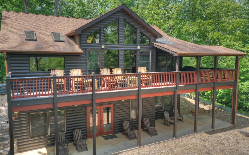 21 Bear Den Road Blue Ridge, GA 30513 - Photo 1 of 4 a view of a house with backyard and porch