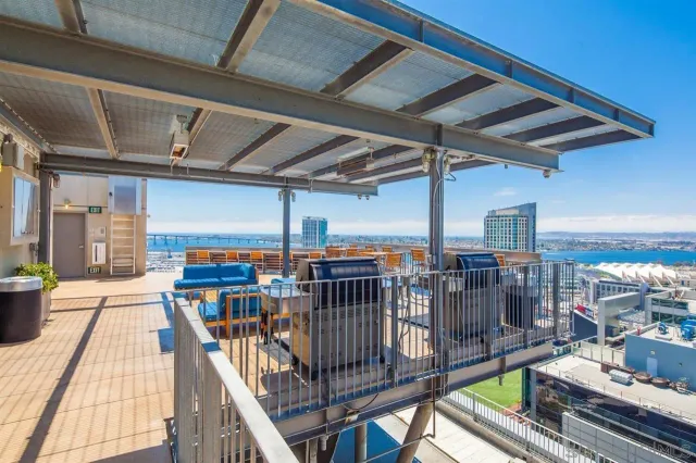 a view of a balcony with seating space