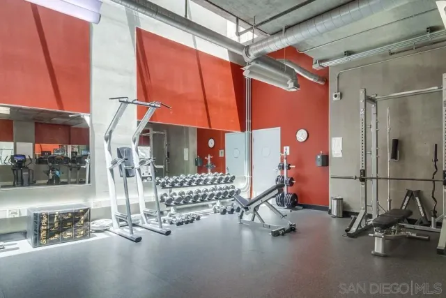a kitchen with granite countertop a stove top oven microwave and cabinets