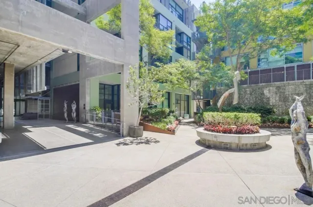 a kitchen with stainless steel appliances granite countertop a stove microwave and refrigerator
