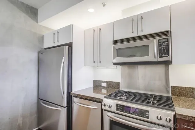a bedroom with a bed and glass door