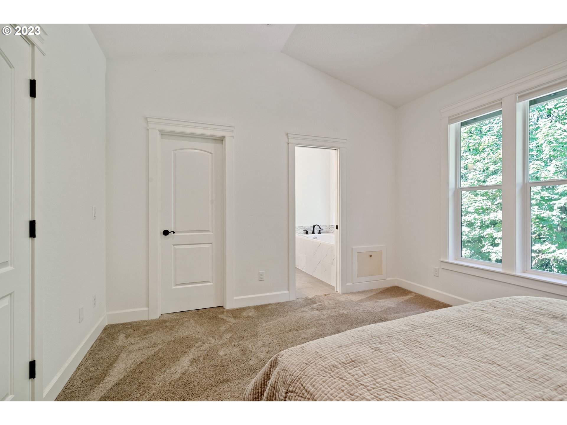 2514 South 19th Court Ridgefield, WA 98642 - Photo 16 of 34 a view of an empty room with wooden floor and a window