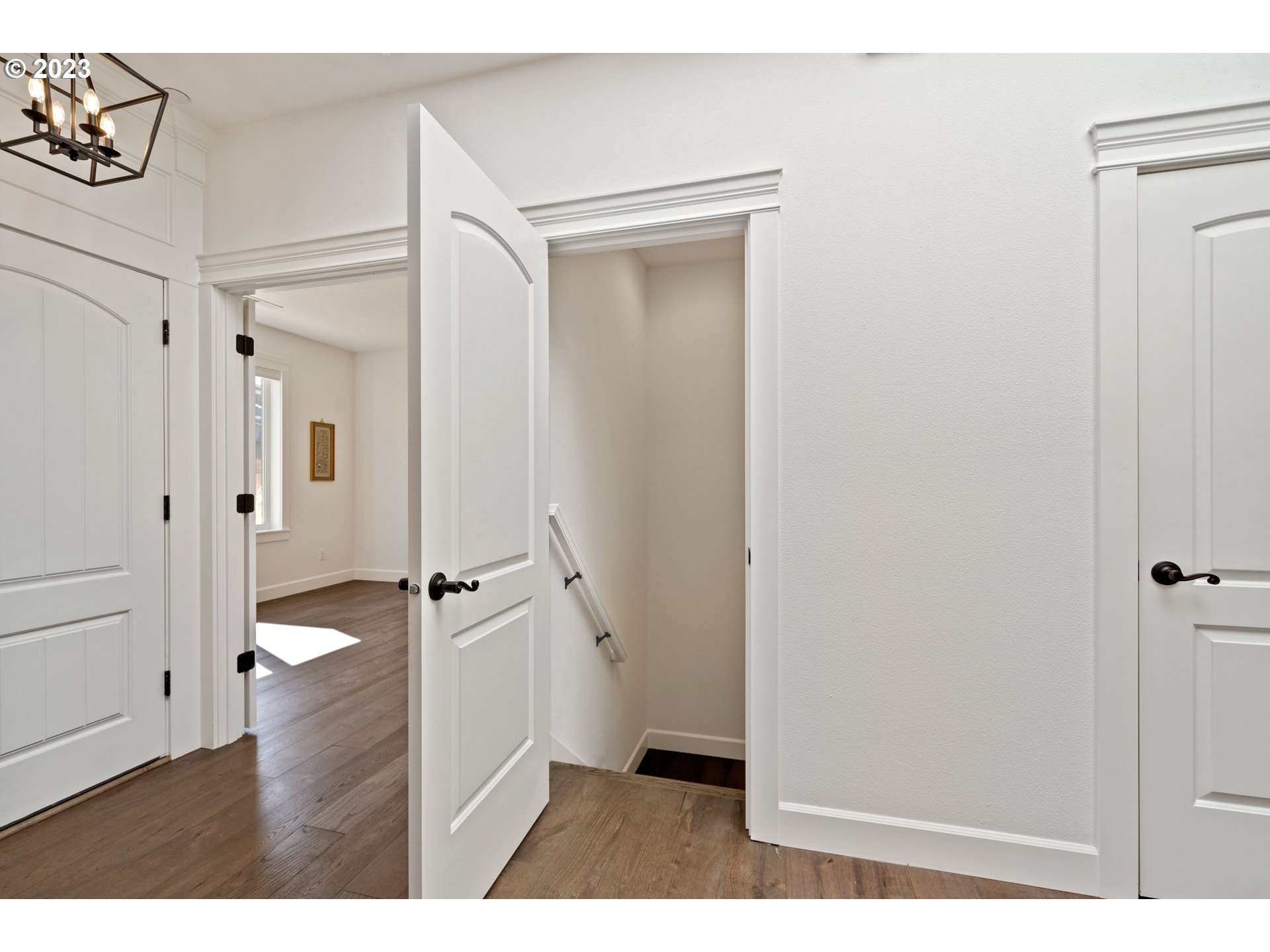 2514 South 19th Court Ridgefield, WA 98642 - Photo 22 of 34 a view of a hallway with wooden floor and staircase
