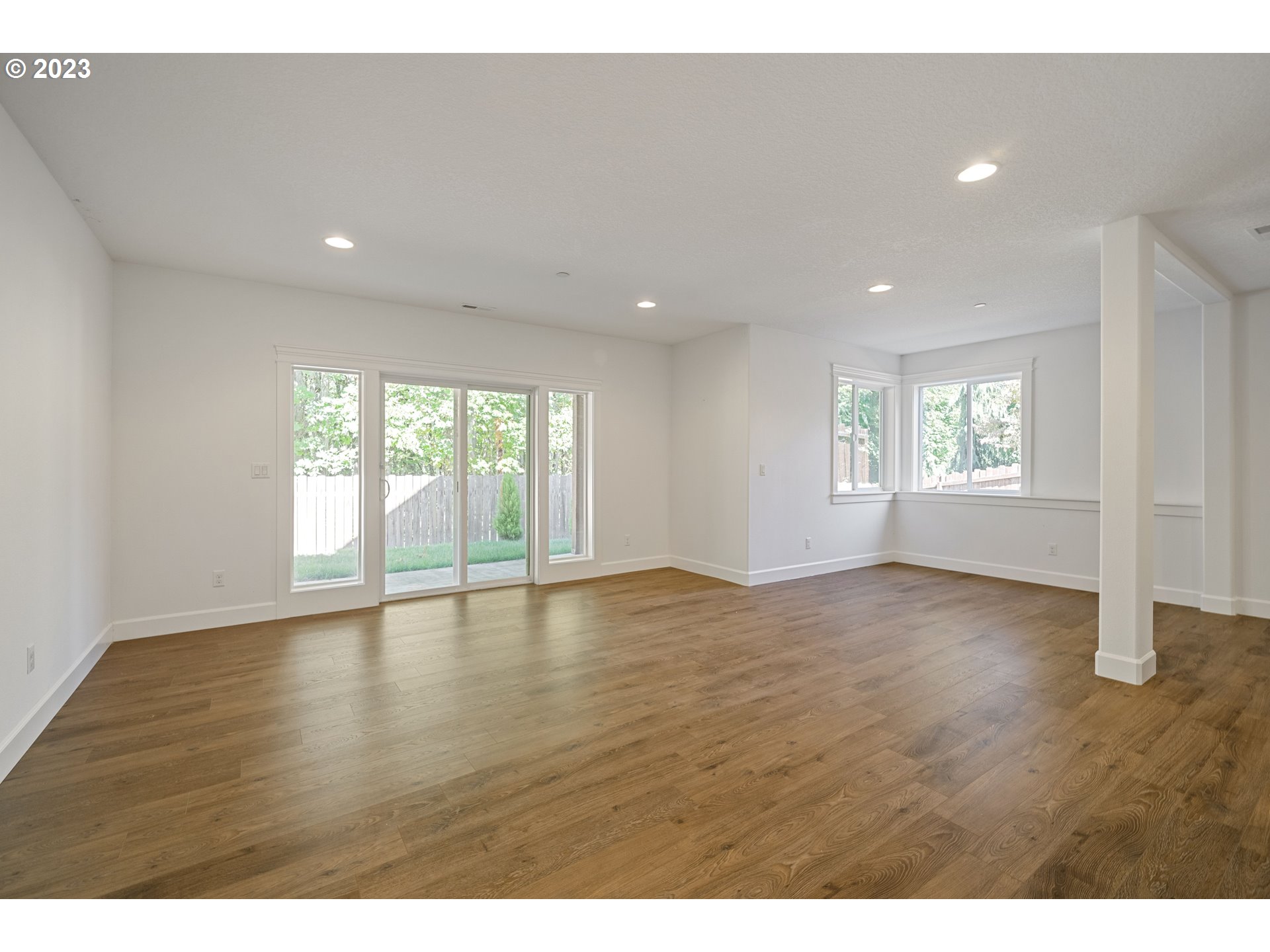 2514 South 19th Court Ridgefield, WA 98642 - Photo 23 of 34 a view of an empty room with a window and wooden floor