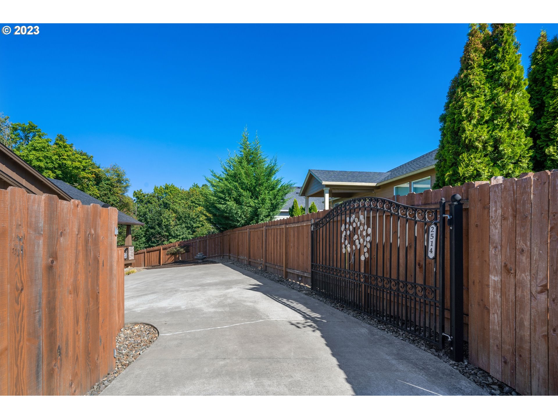 2514 South 19th Court Ridgefield, WA 98642 - Photo 31 of 34 a view of a backyard with wooden fence