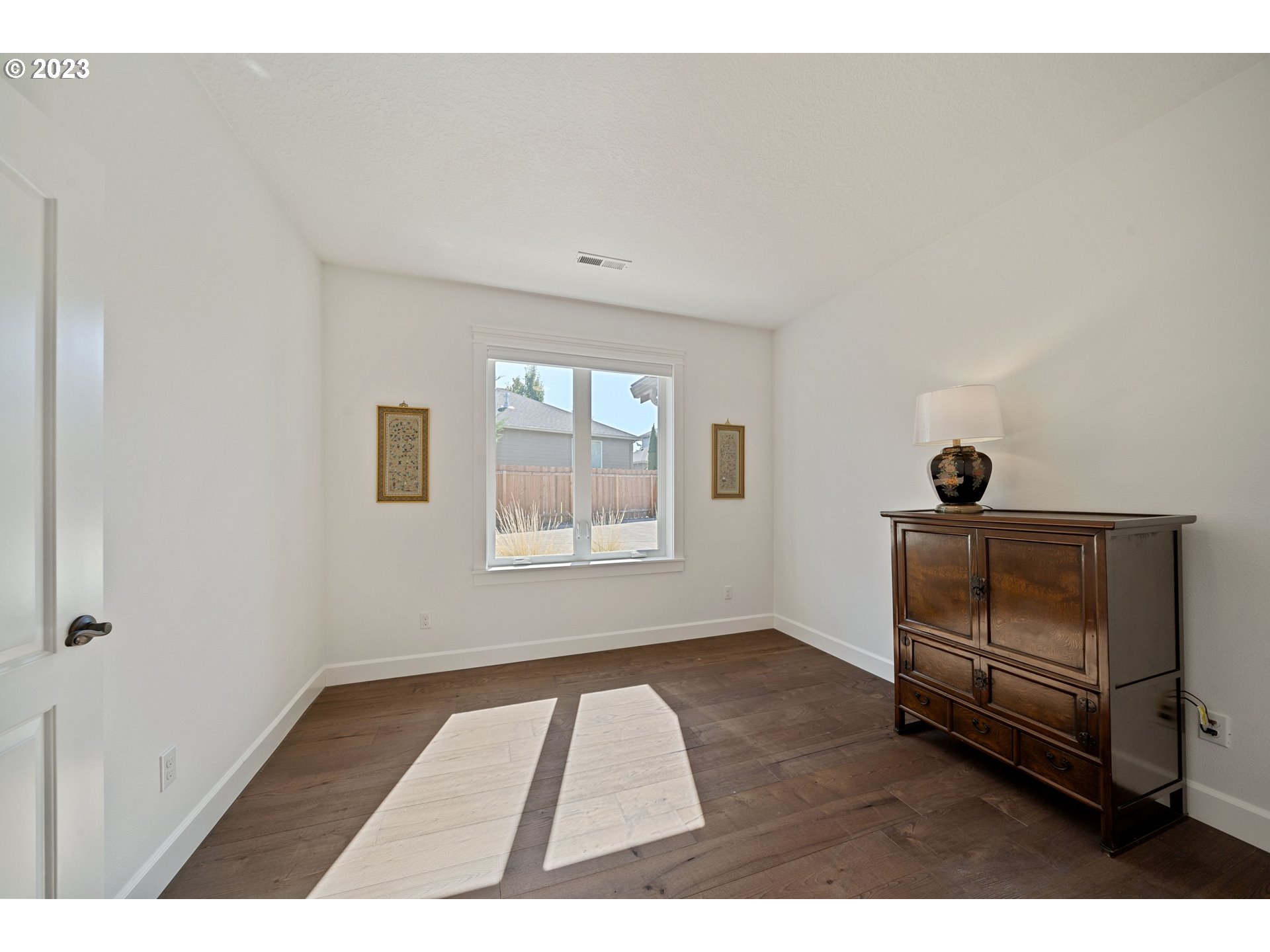 2514 South 19th Court Ridgefield, WA 98642 - Photo 7 of 34 a view of an empty room with a window