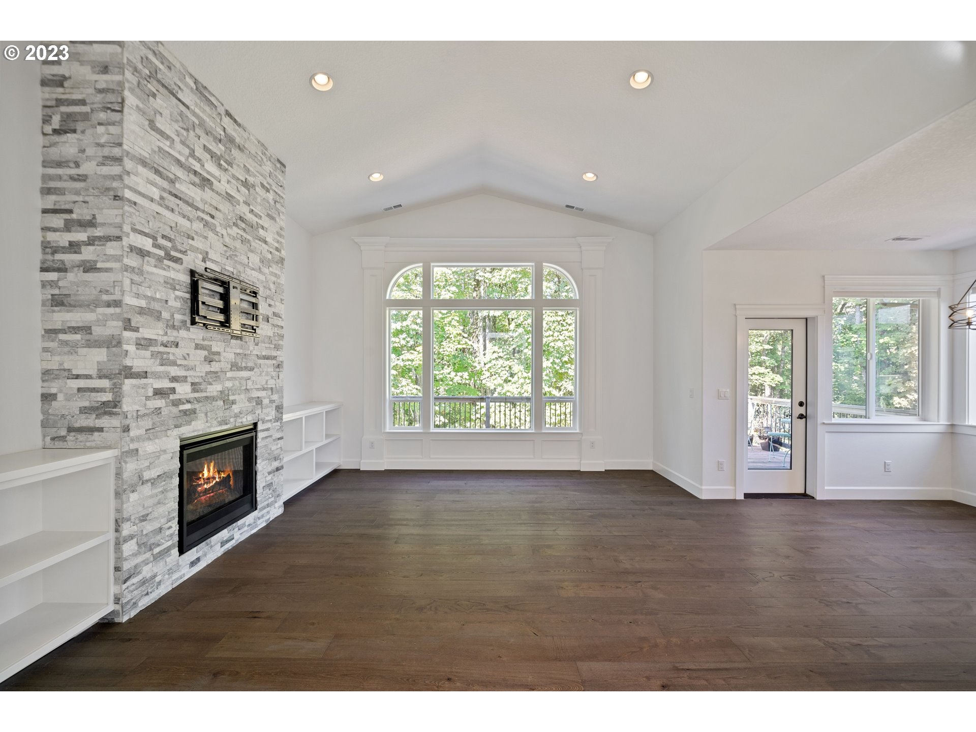 2514 South 19th Court Ridgefield, WA 98642 - Photo 8 of 34 a view of an empty room with a fireplace and a window