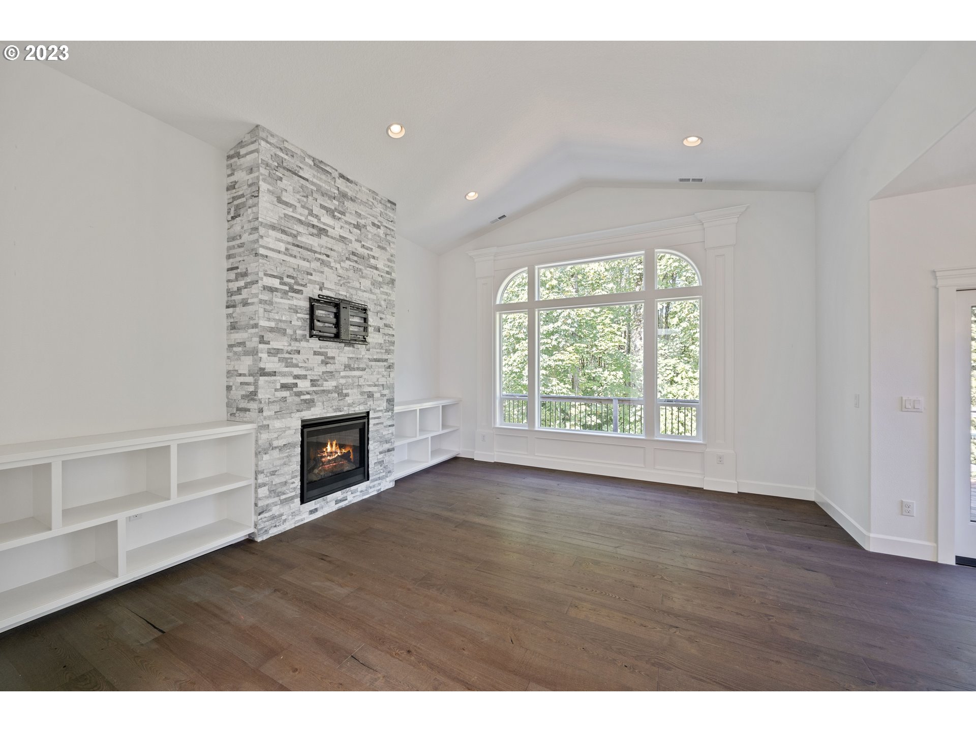 2514 South 19th Court Ridgefield, WA 98642 - Photo 9 of 34 a view of an empty room with a fireplace and a window