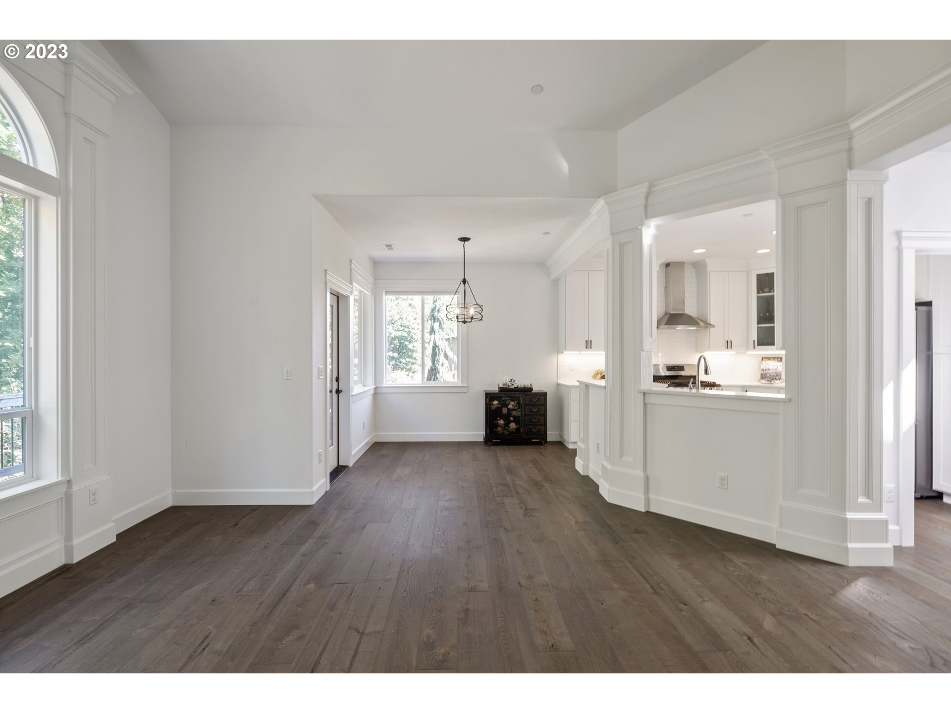 2514 South 19th Court Ridgefield, WA 98642 - Photo 10 of 34 a view of a big room with wooden floor and windows