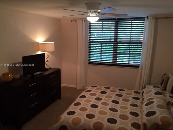 a bathroom with a sink a light fixture and a toilet