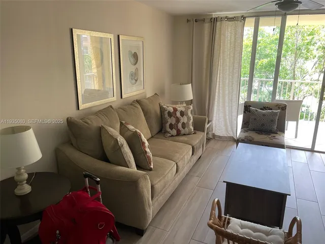 a front view of multiple houses with yard