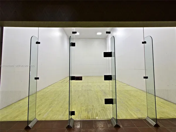 a view of a park with iron fence