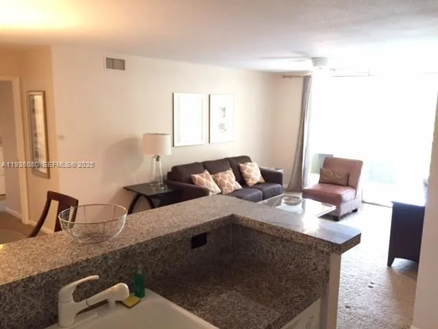 a close view of a sink and a table in a room