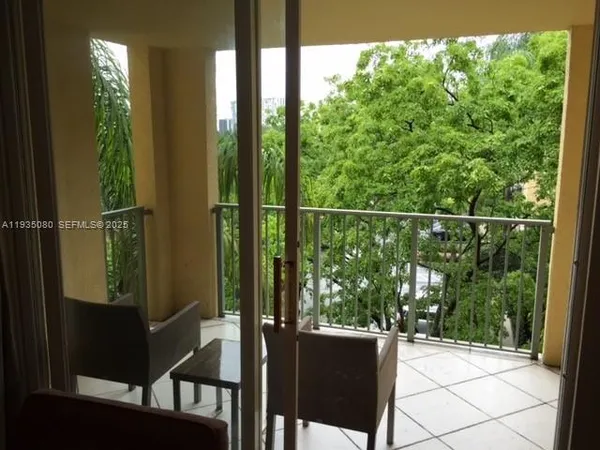 a living room with furniture and a mirror