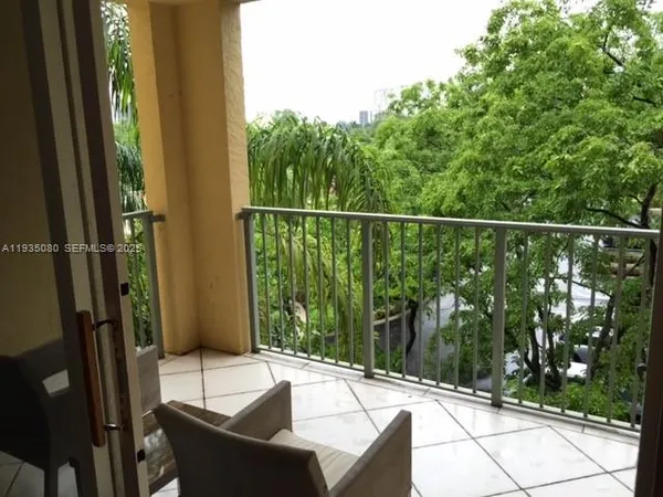 a bathroom with a toilet and a shower curtain