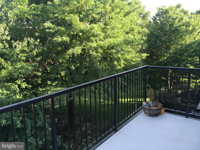 a view of a balcony with roof deck