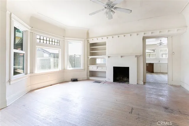 a view of a kitchen with a sink and cabinets