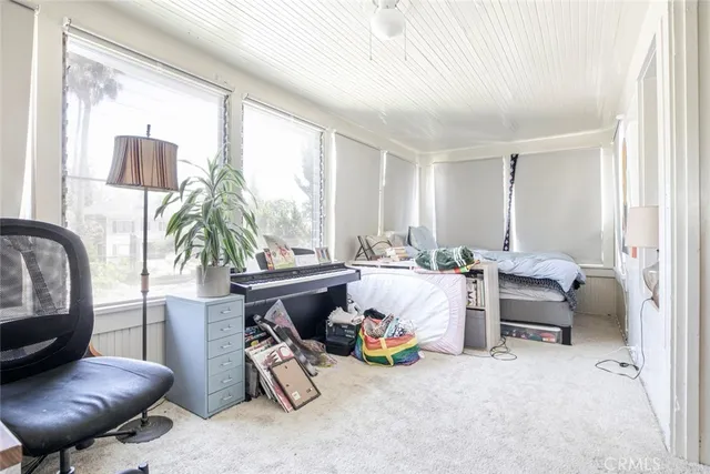 a view of a pathway with a garden